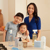Blueland Founder Sarah and her two young children behind a table of Blueland cleaning products