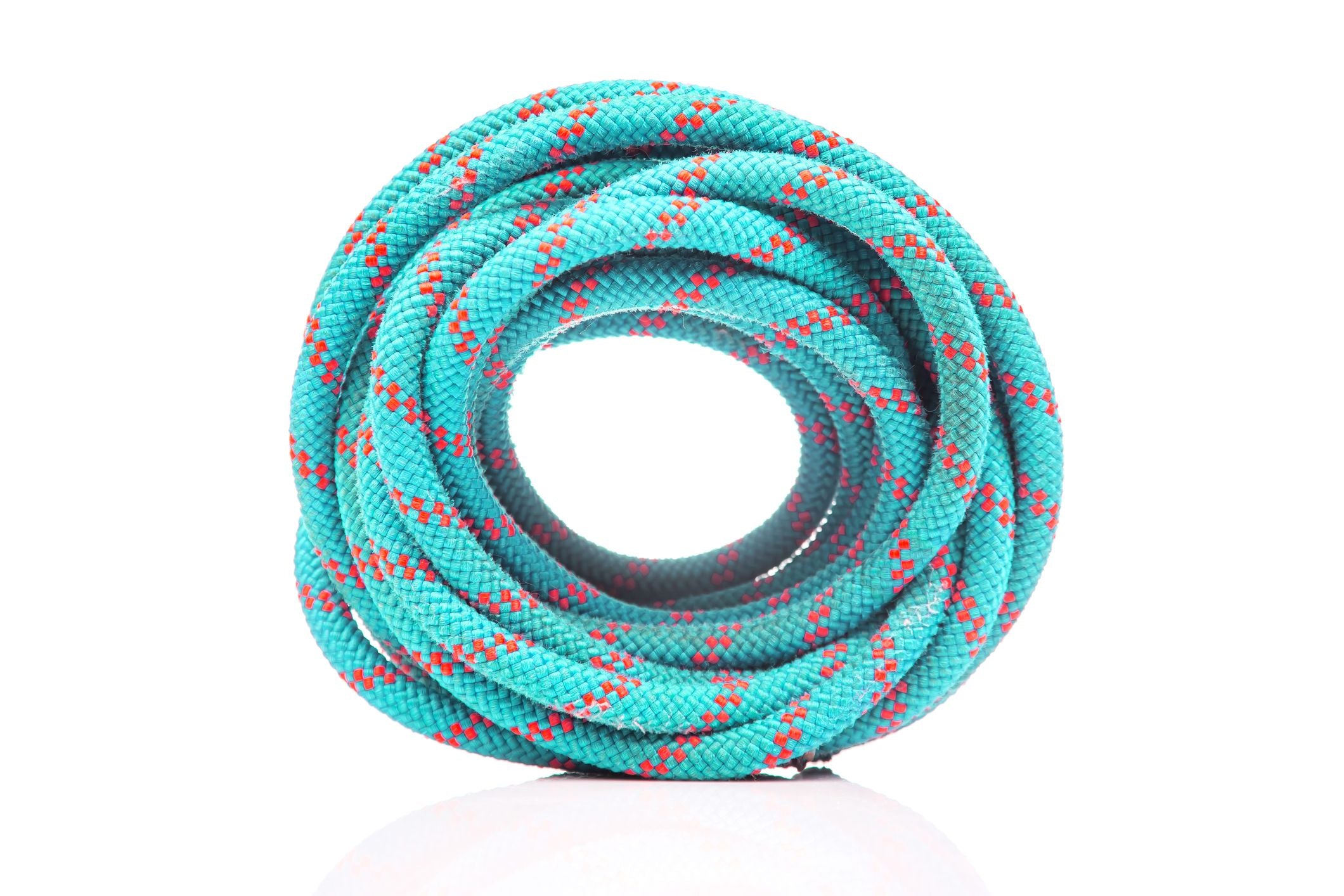 A neatly coiled blue rope with red and white patterns on a white background, shown from the front.